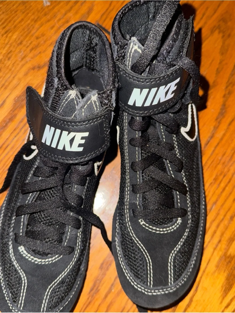 Nike Kids Black High-Top Sneakers with White Swoosh